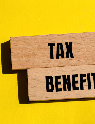 tax-benefits-words-written-wooden-blocks-with-yellow-background-conceptual-tax-benefits-symbol