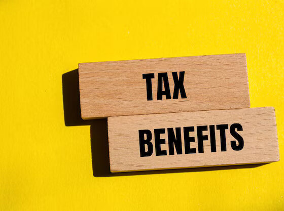 tax-benefits-words-written-wooden-blocks-with-yellow-background-conceptual-tax-benefits-symbol