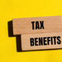 tax-benefits-words-written-wooden-blocks-with-yellow-background-conceptual-tax-benefits-symbol